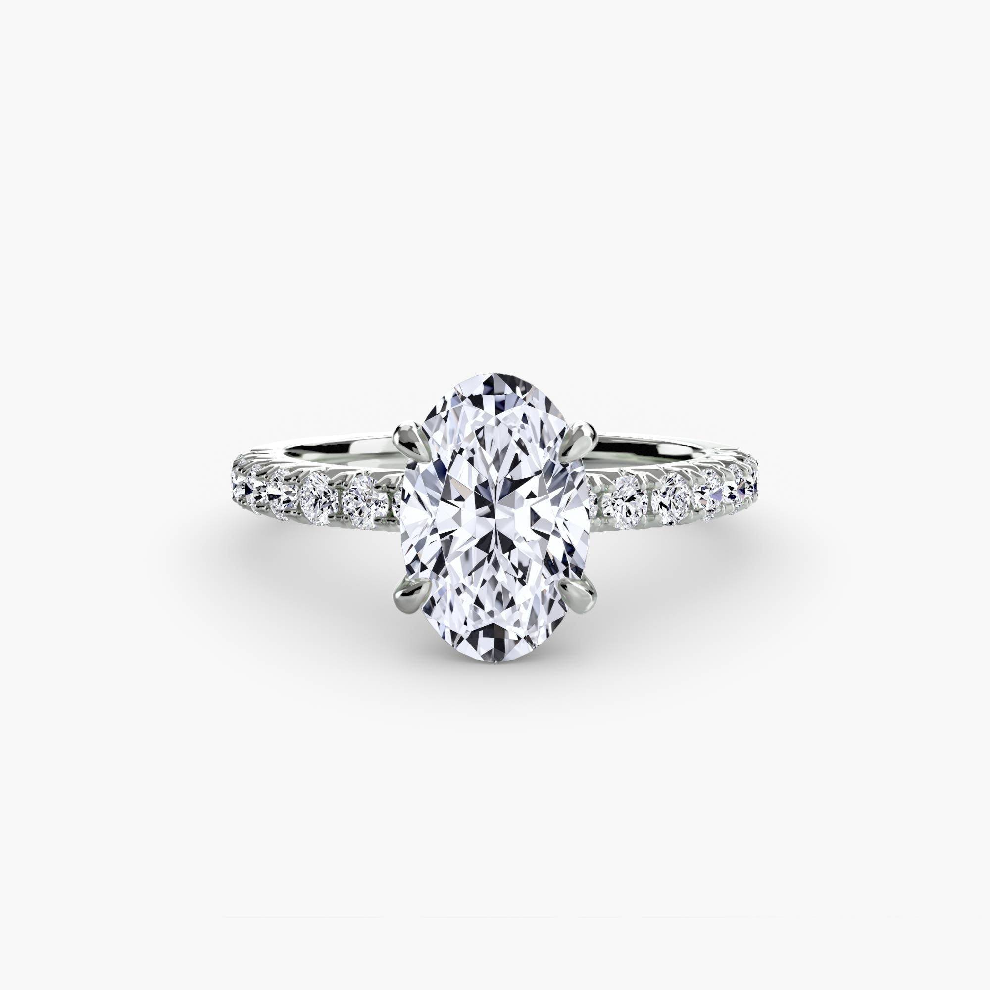 bague Solys personnalisée avec un diamant de laboratoire central de forme ovale. L'anneau en or gris est rehaussé d'une ligne de petits diamants de laboratoire. Maison française Exquisite Lab Diamonds.